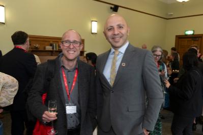 Two men smiling